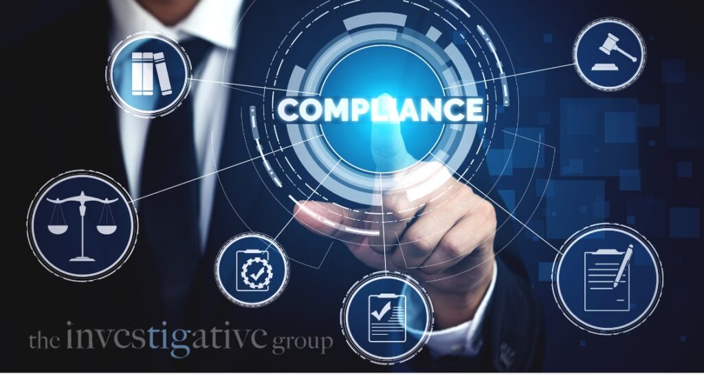 image depicting a mans hand pointing to word compliance